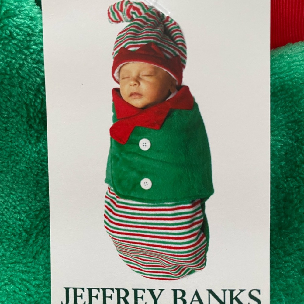 Adorable christmas elf swaddle with hat. Used once for pictures. Jeffrey Banks.